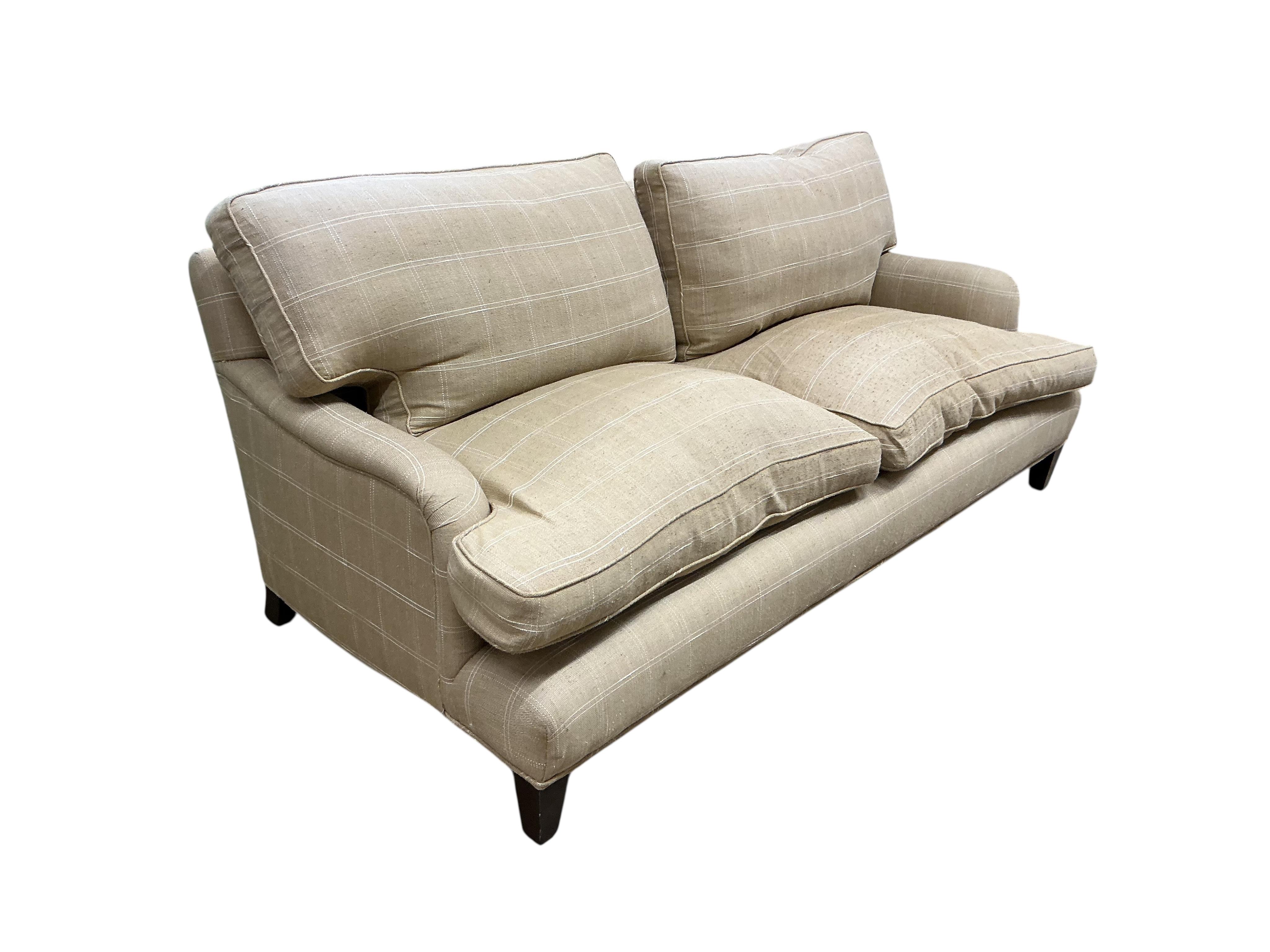 A pair of large grey and white squared upholstered settees, width 200cm, depth 90cm, height 84cm and a pair of matching armchairs